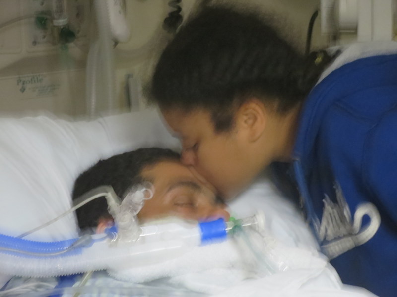 Tea gives her father a last kiss.
