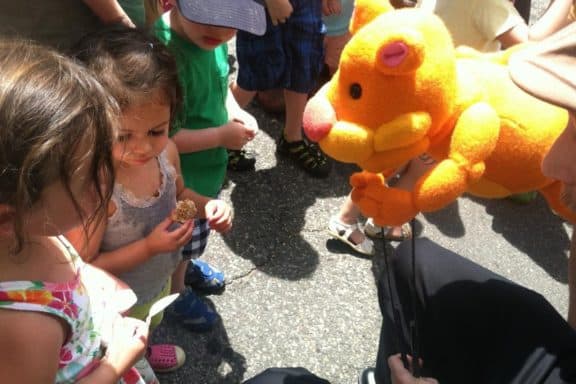 Close-up - Photo of Tuffy the Tiger puppet entertaining toddlers. courtesy of Puppetry Arts