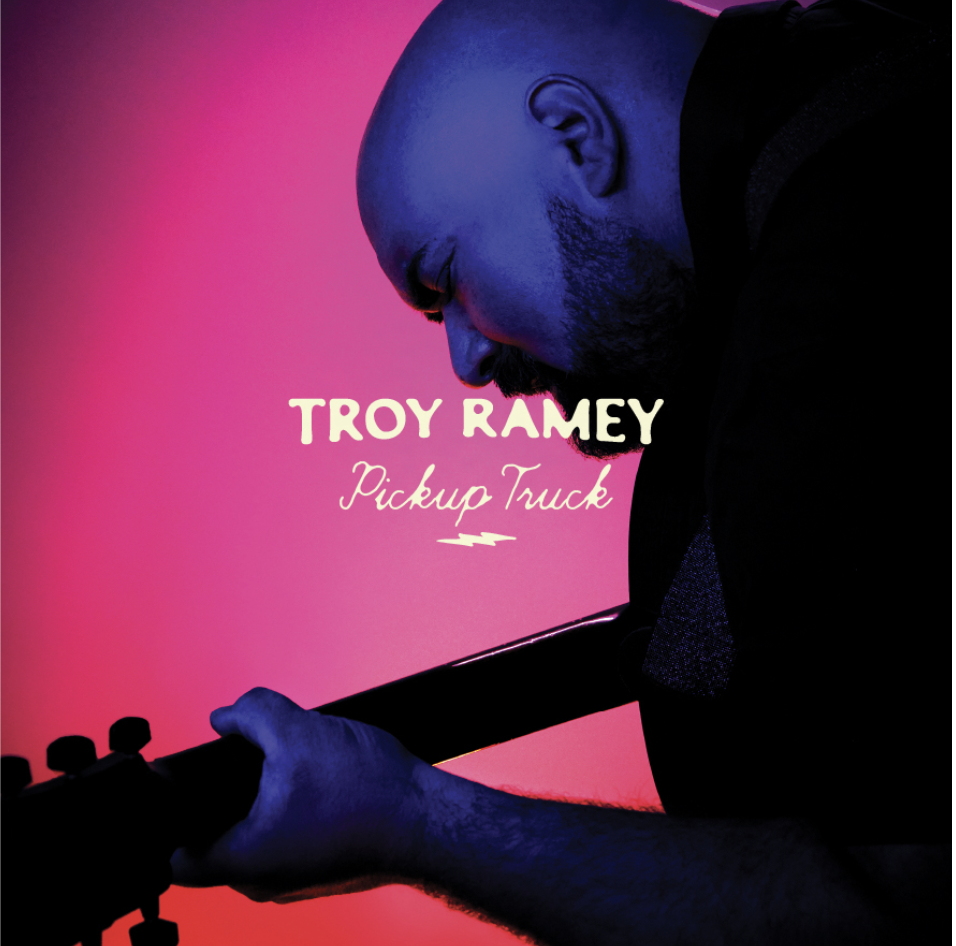 Picture of Troy Ramsey Holding a Guitar for the Cover Art of his single, Pick Up Truck.